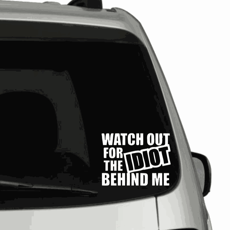 Funny car decal "Watch out for the Idiot Behind Me" on rear window. Durable vinyl.