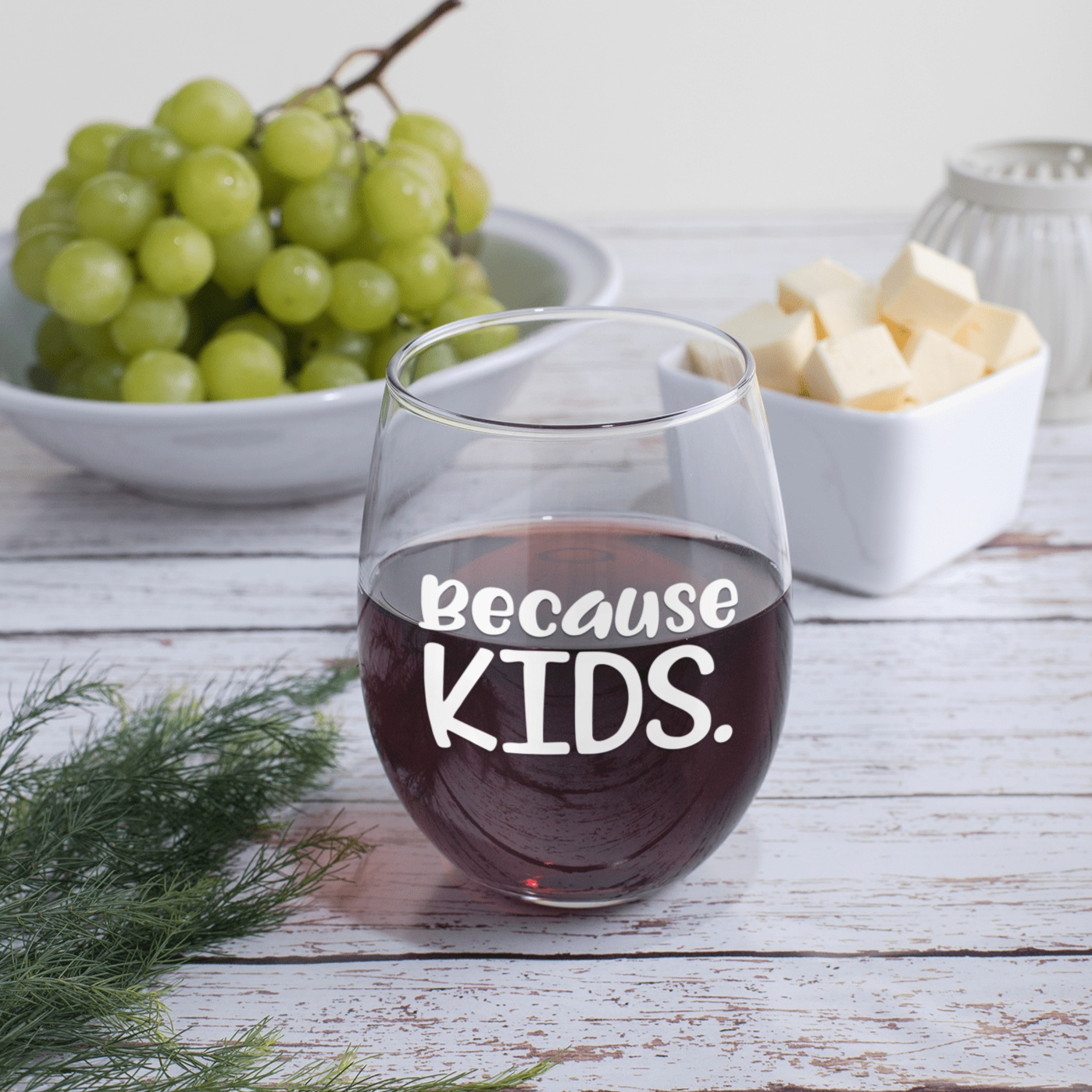 Stemless wine glass with "Because Kids" text, ideal gift for parents, 17 oz capacity.