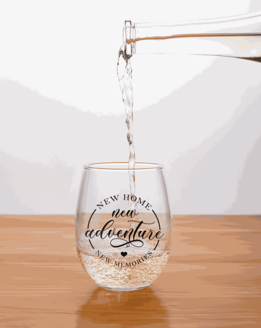 Set of two 20 oz stemless wine glasses with "New Home New Adventures" design. Perfect gift for new homeowners.