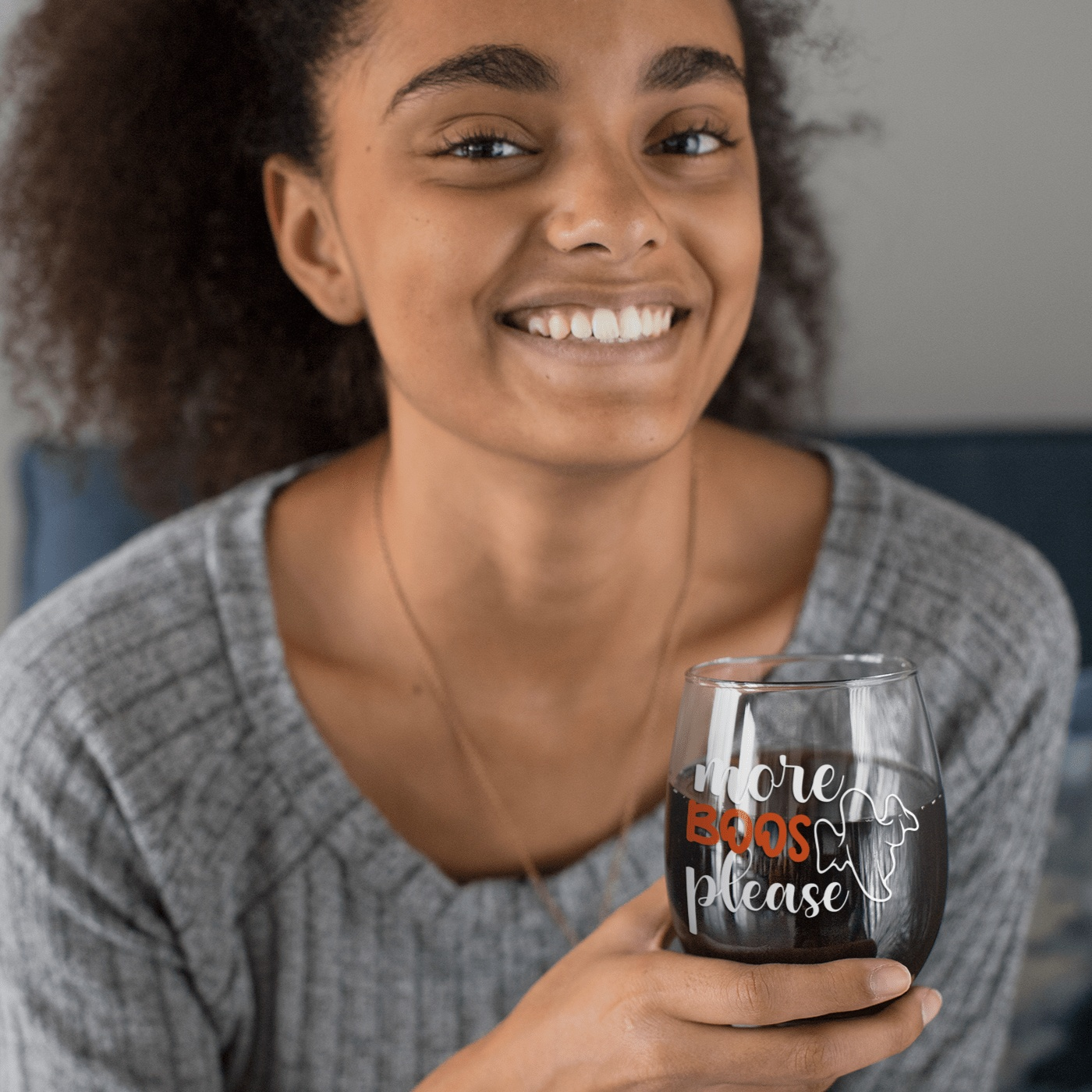 Fall-themed "More Boos Please" stemless wine glass for Halloween celebrations.