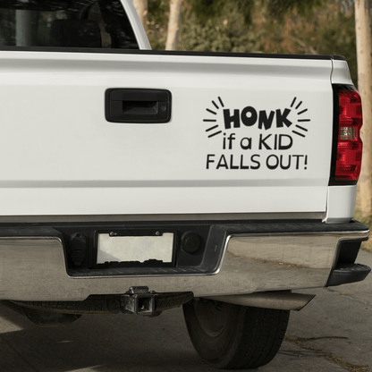 Funny car decal on truck tailgate reading "Honk if a Kid Falls Out."