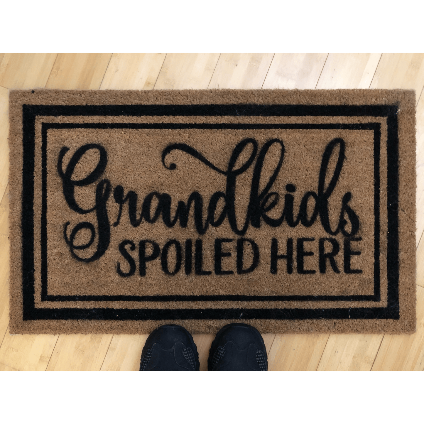 Personalized coir doormat with "Grandkids Spoiled Here" text, 24x16 inches, outdoor use.