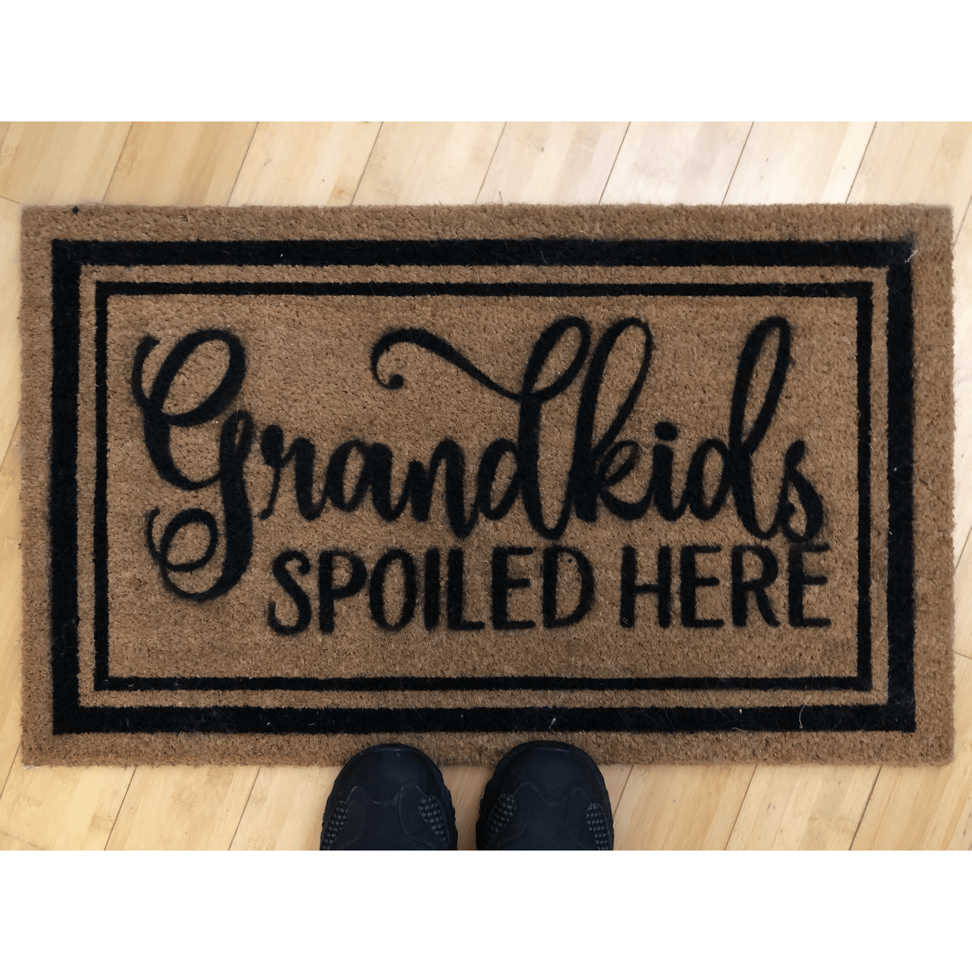 Personalized coir doormat with "Grandkids Spoiled Here" text, 24x16 inches, outdoor use.