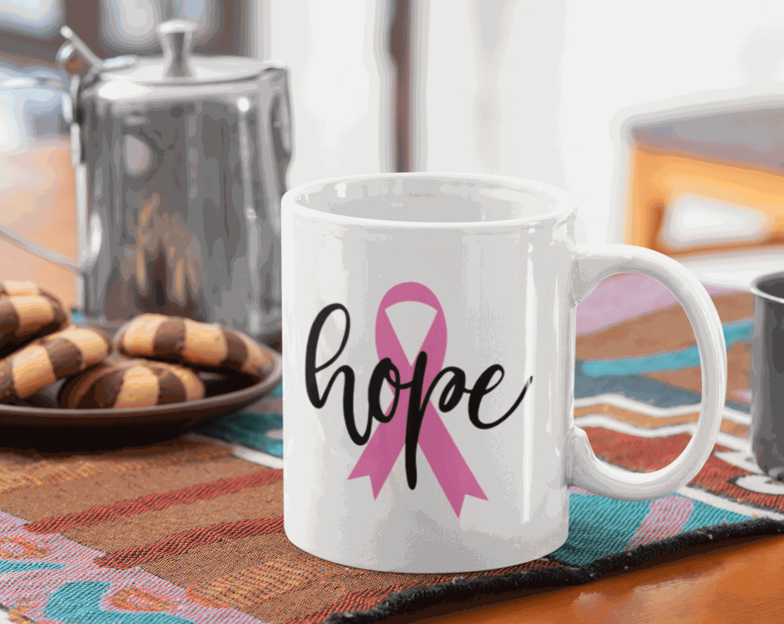 Hope and Pink Ribbon Cancer Awareness Mug on table with cookies and coffee pot.
