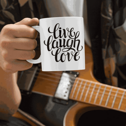 White ceramic coffee mug with "Live, Laugh, Love" design.