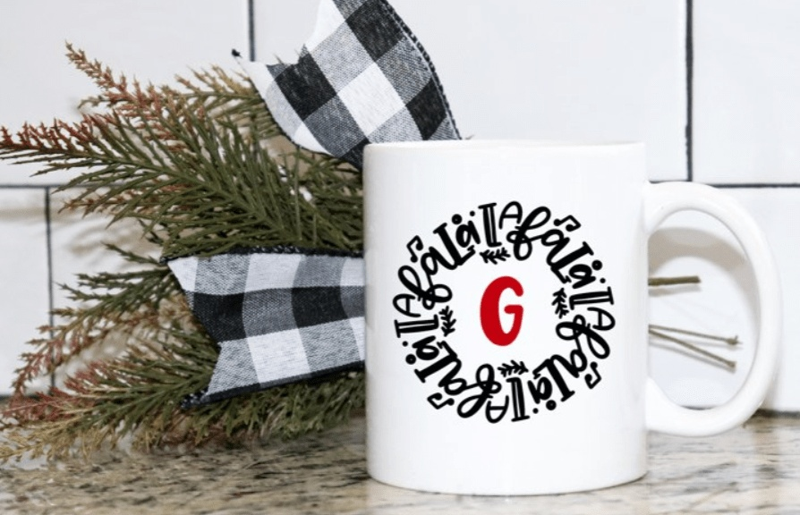Personalized Christmas mug with initial "G" and FaLaLaLa design.