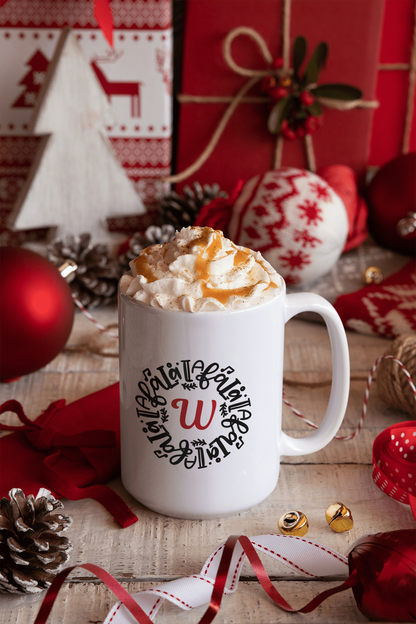 Personalized Christmas mug with whipped cream, surrounded by festive decor, featuring a custom initial design.