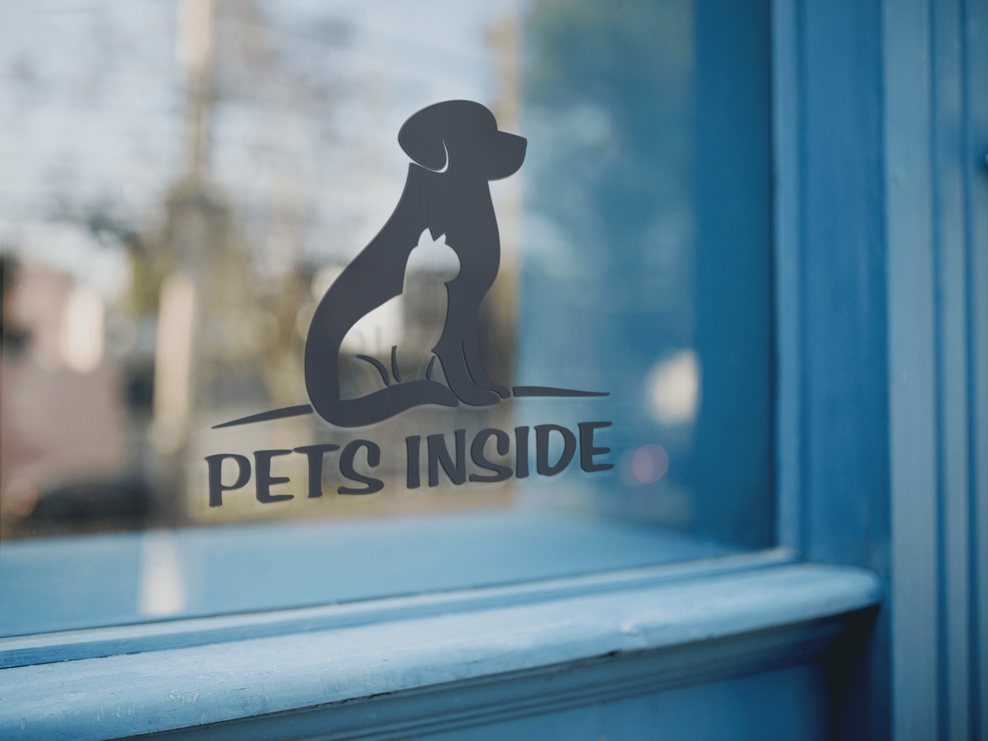 Pet emergency window decal indicating pets inside for first responders on a glass surface.