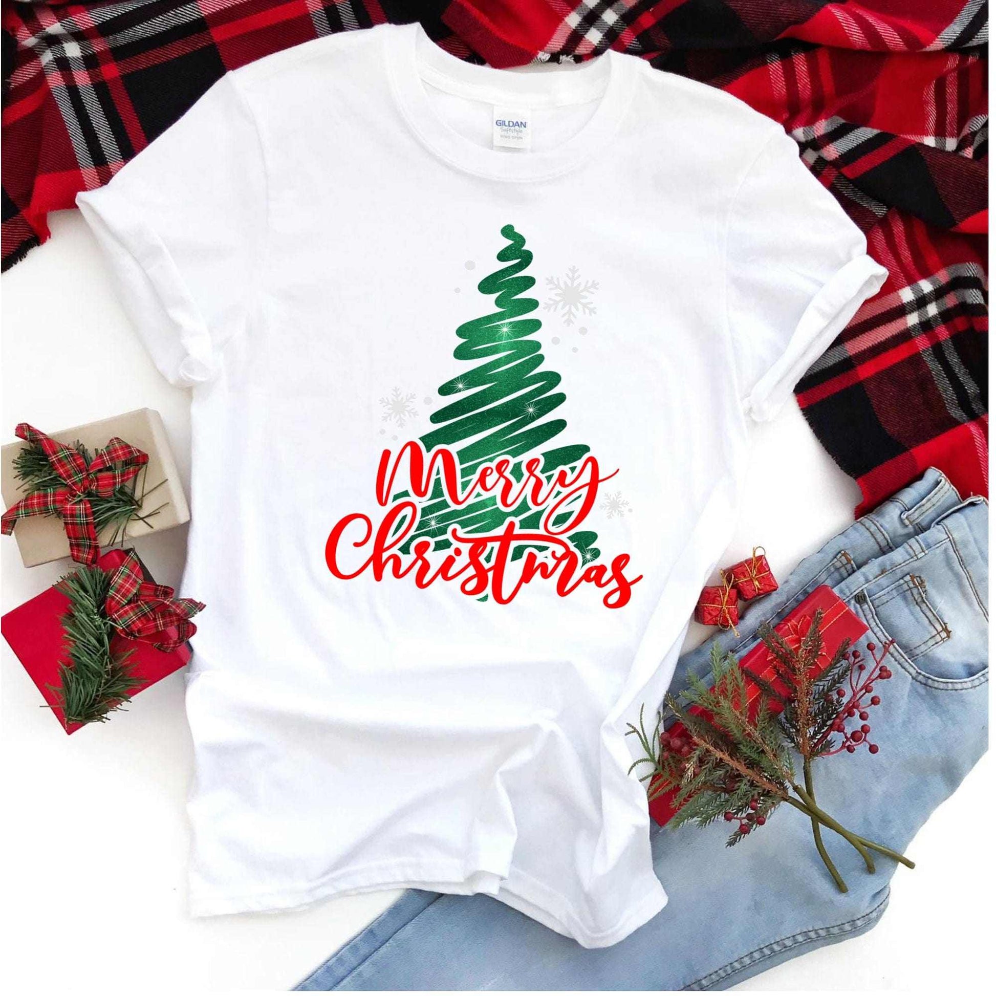 Merry Christmas glitter tree shirt on festive background, holiday apparel.