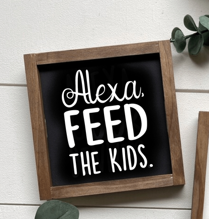 Handcrafted "Alexa, Feed The Kids" wood sign with black background and white lettering.