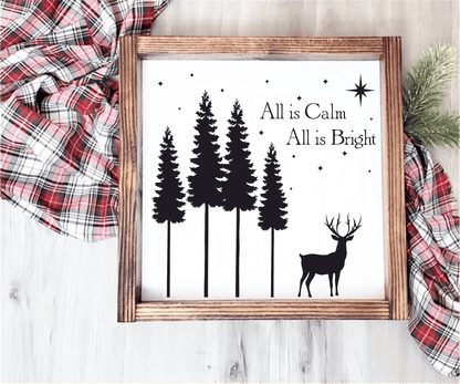 Christmas wood sign with "All is Calm, All is Bright" text, featuring pine trees and a reindeer silhouette.
