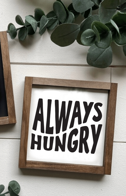 Handmade "Always Hungry" wood sign with black lettering on white background, framed and ready to hang.