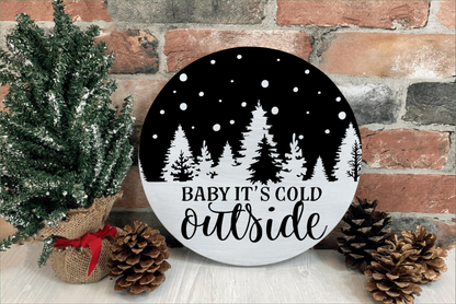 Handmade "Baby It's Cold Outside" wood sign with pine tree design, rustic holiday decor.