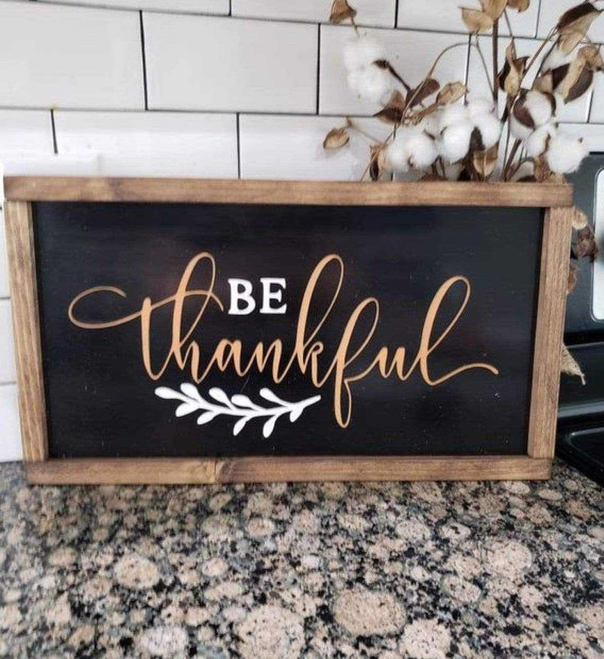Handcrafted "Be Thankful" wood sign with rustic distressed finish, chalk black background, white and orange lettering, and stained pine frame.