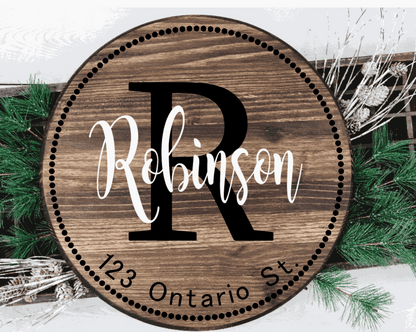 Custom family wood door sign with address and initial, featuring personalized design on knotty pine.