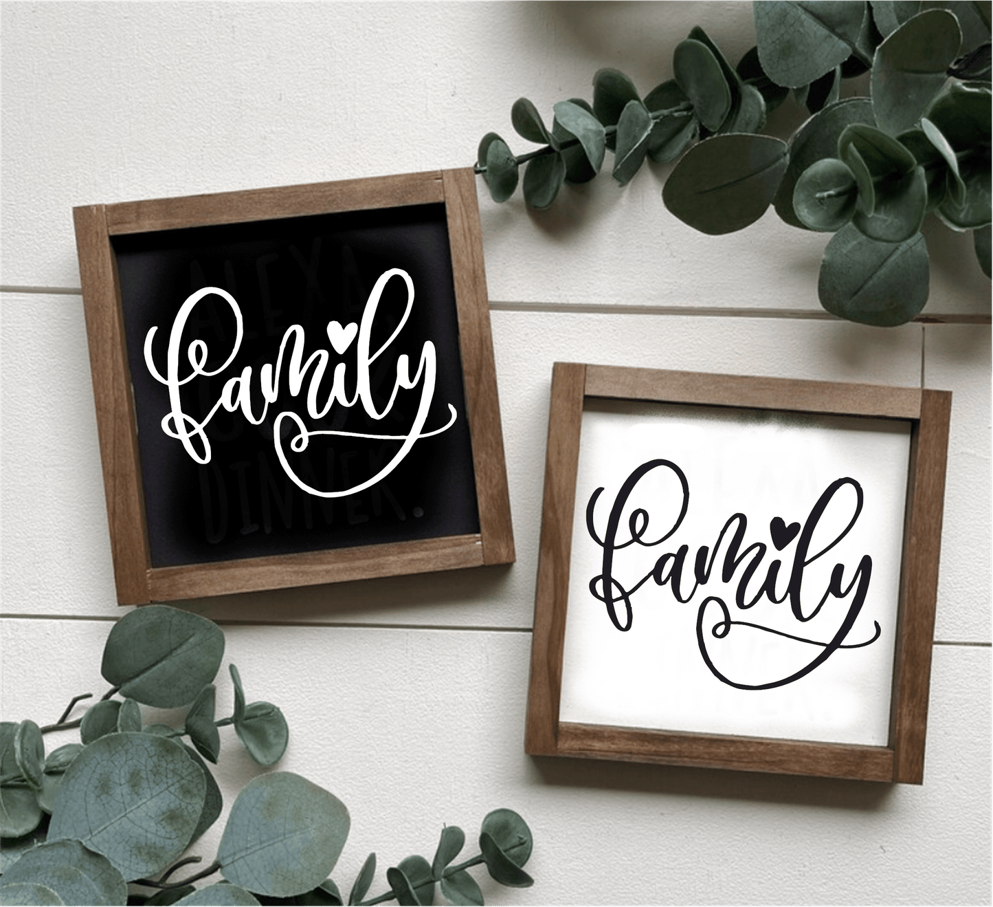 Handcrafted family wood signs with black and white lettering, natural wood frames, and greenery decoration.