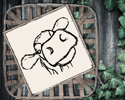 Farmhouse cow wood sign with black cow face on white background, rustic decor.
