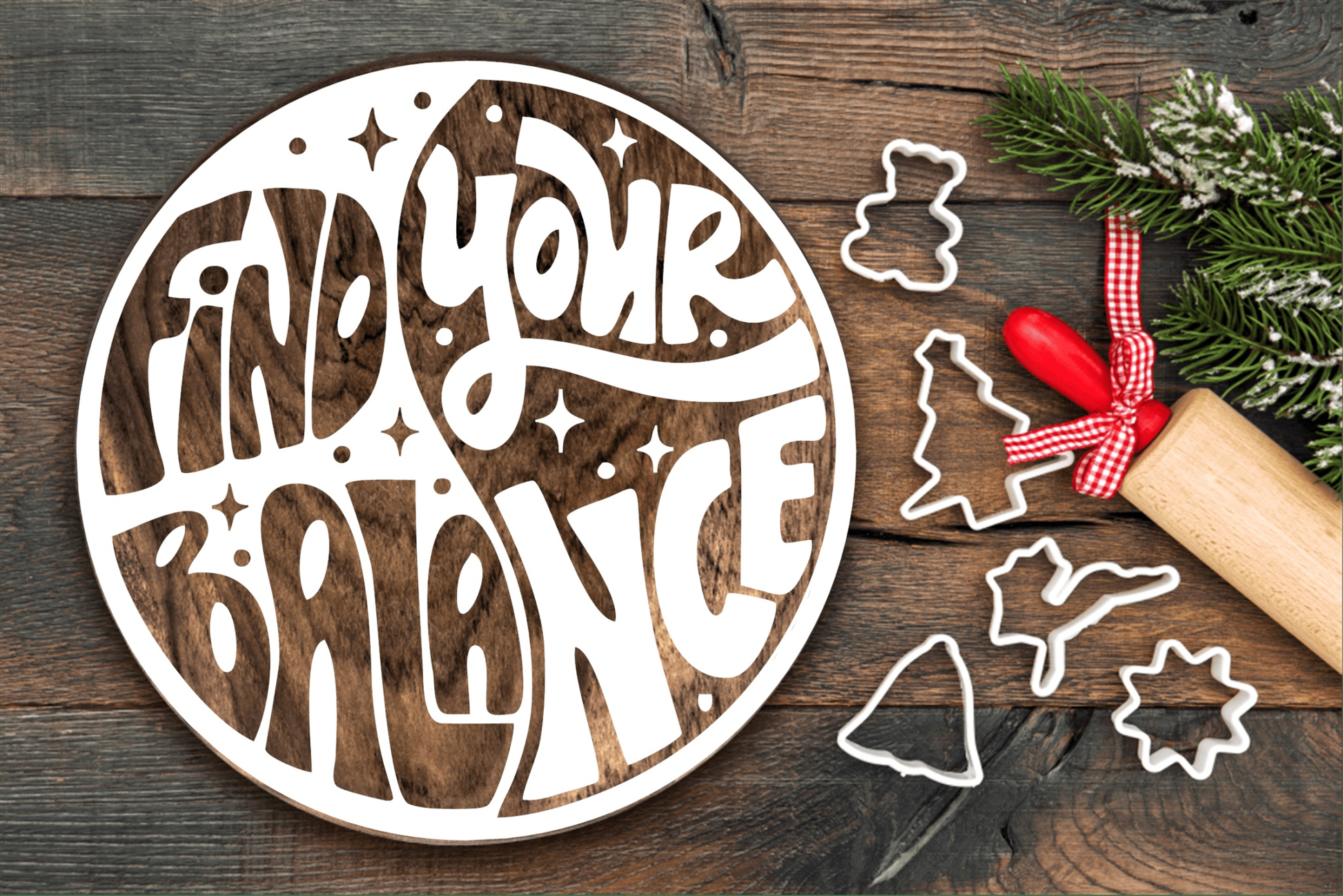 Round wooden sign with "Find Your Balance" design, featuring yin-yang layout, ideal for home decor or gift, surrounded by holiday baking items.