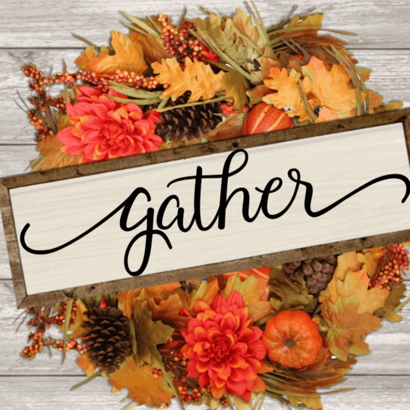 Handcrafted farmhouse wood sign with "gather" text, surrounded by fall leaves and flowers.