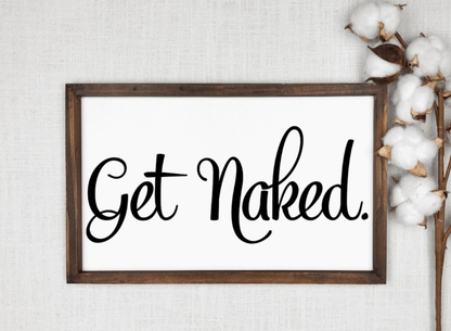 Get Naked rustic bathroom wood sign with black lettering on a white background and a wooden frame.