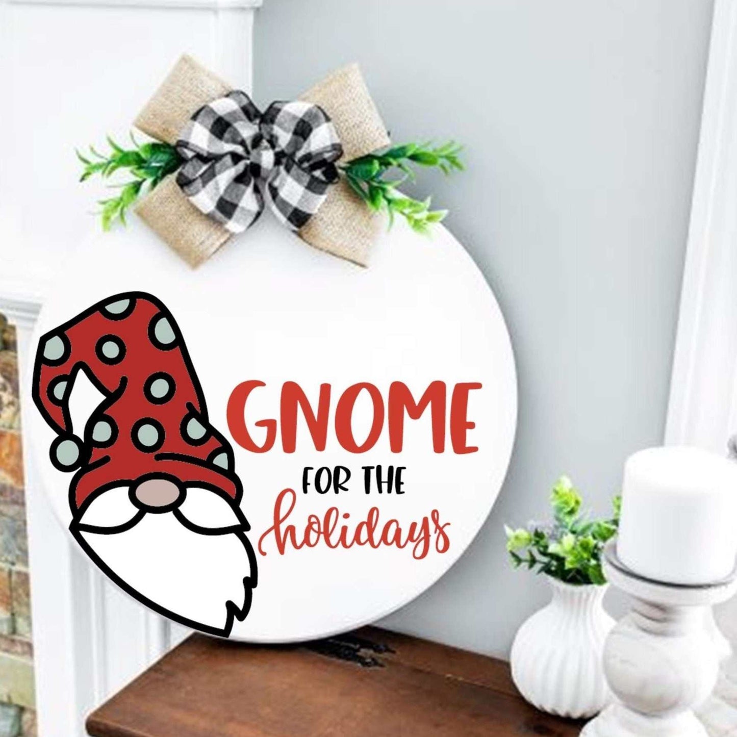 Holiday-themed gnome wood round sign with plaid bow, perfect for mantle or shelf display.