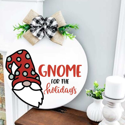 Holiday-themed gnome wood round sign with plaid bow, perfect for mantle or shelf display.