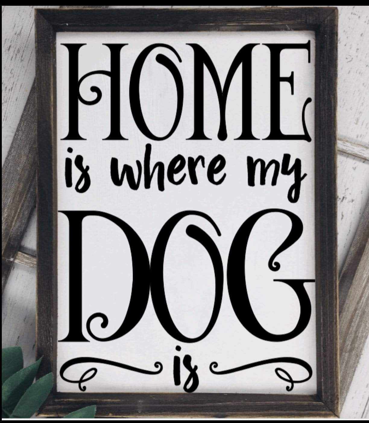 Handmade wood sign with "Home is where the Dog is" text, black lettering on white background.