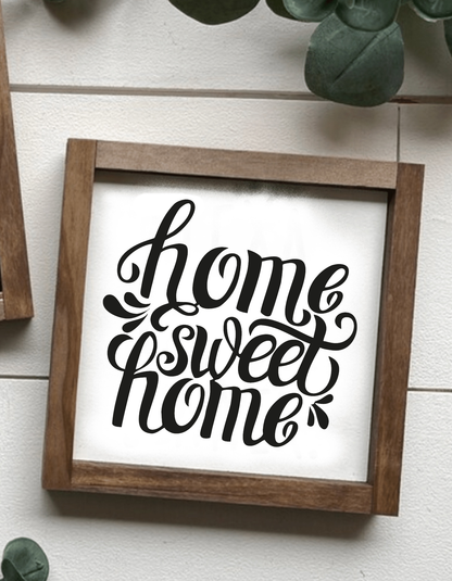 Handcrafted "Home Sweet Home" framed wood sign with black lettering on a white background.