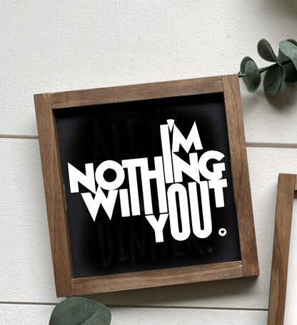 Handcrafted wooden sign with "I'm Nothing Without You" text in black and white, farmhouse decor.