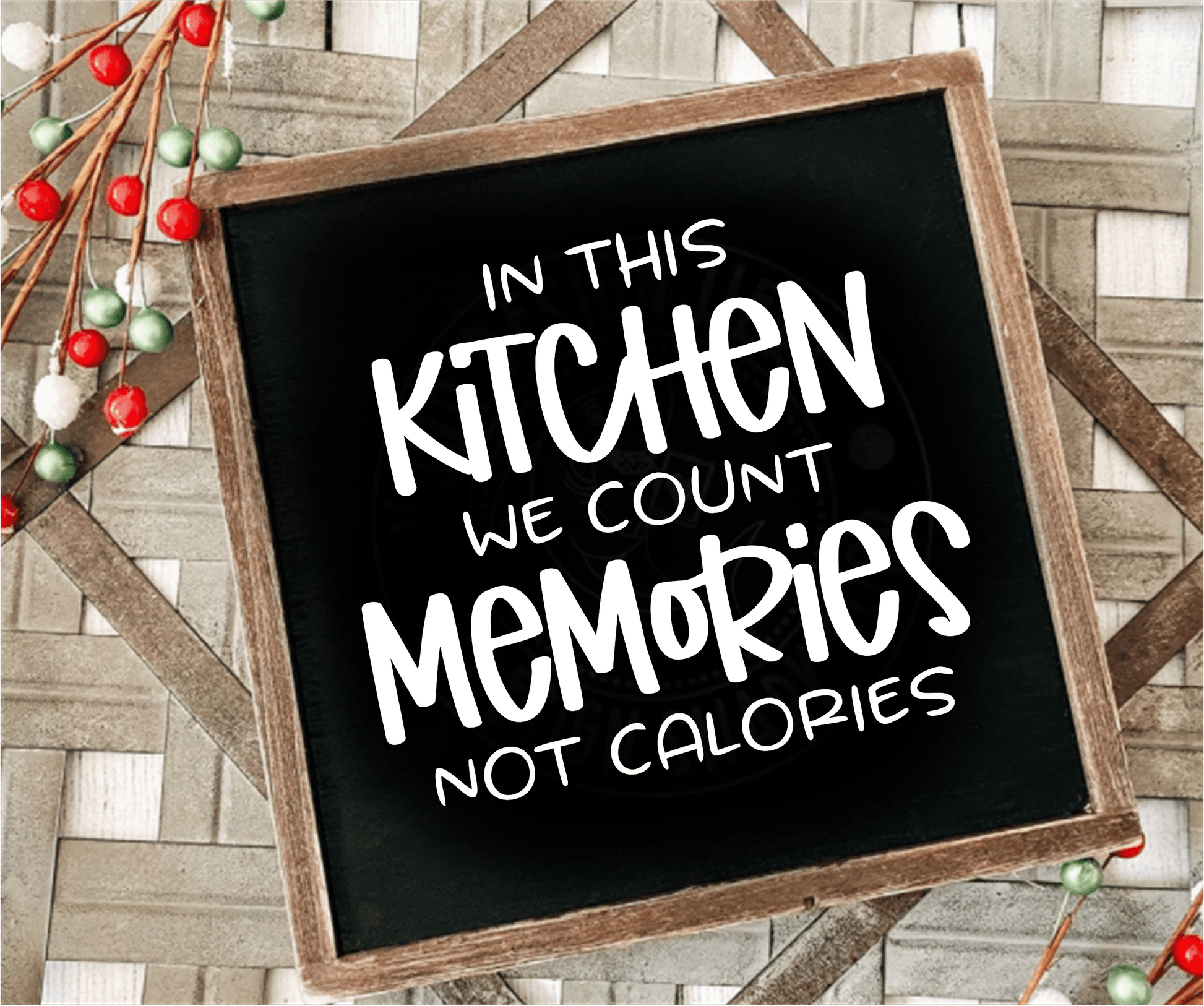 Framed wood sign with "In this Kitchen we Count Memories not Calories" on a black background.