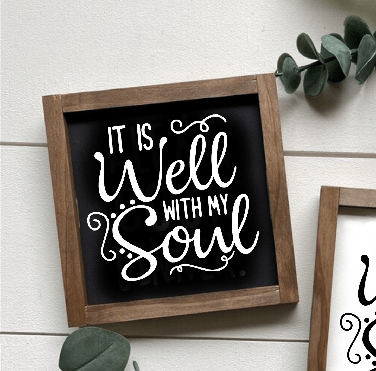 Handcrafted wood sign with "It is Well with my Soul" text, black background, and white lettering, framed in wood.