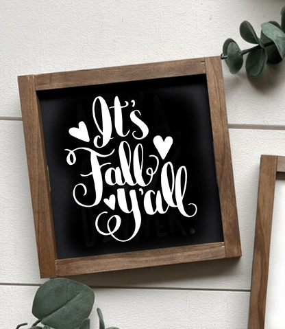 Handcrafted "It's Fall Y'all" wooden sign with black background and white lettering in a stained frame, perfect for seasonal decor.