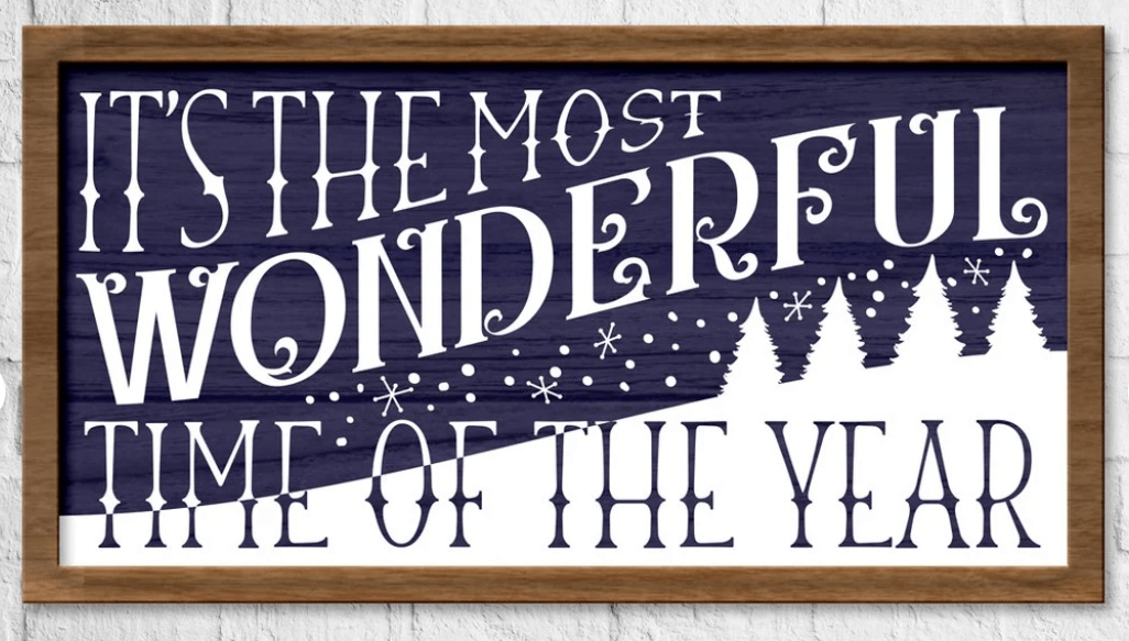 Festive framed wood sign with "It's the Most Wonderful Time of the Year" in white lettering on a dark background, pine wood frame.