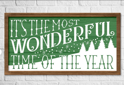 Festive framed wood sign with "It's the Most Wonderful Time of the Year" in white text on a green background, pine frame, 10x20 inches.
