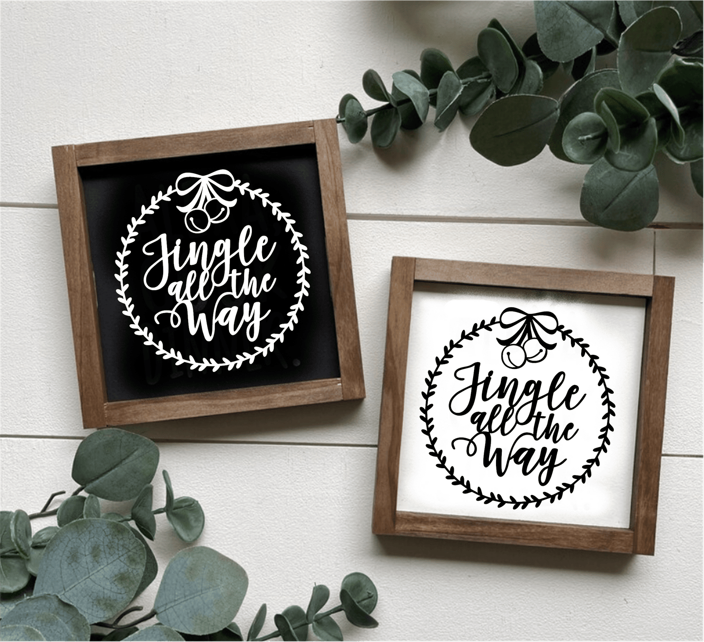 Handcrafted "Jingle All the Way" framed wood signs with festive design, available in black and white backgrounds.