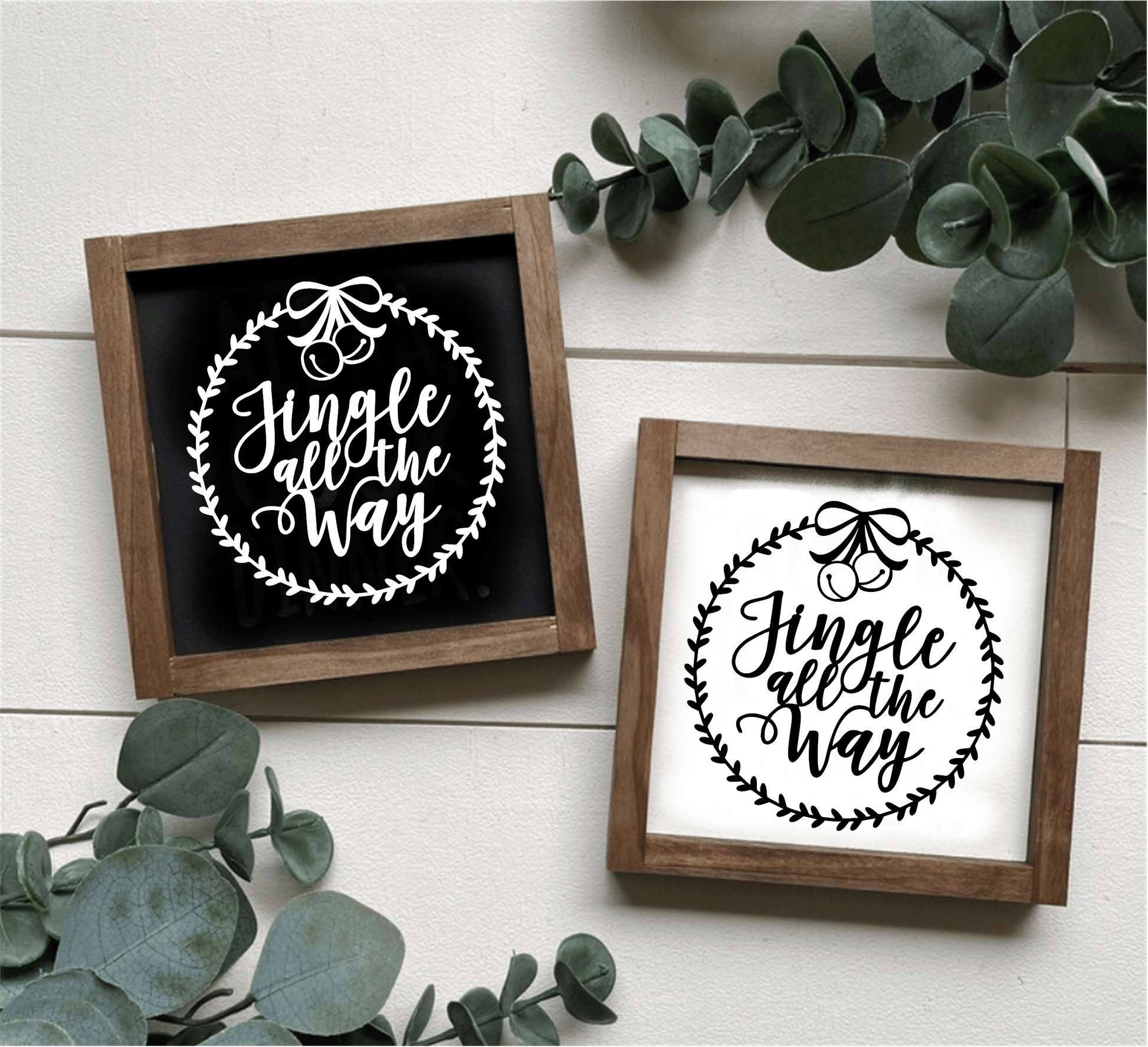 Handcrafted "Jingle All the Way" framed wood signs with festive design, available in black and white backgrounds.