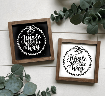 Handcrafted "Jingle All the Way" framed wood signs with festive design, available in black and white backgrounds.