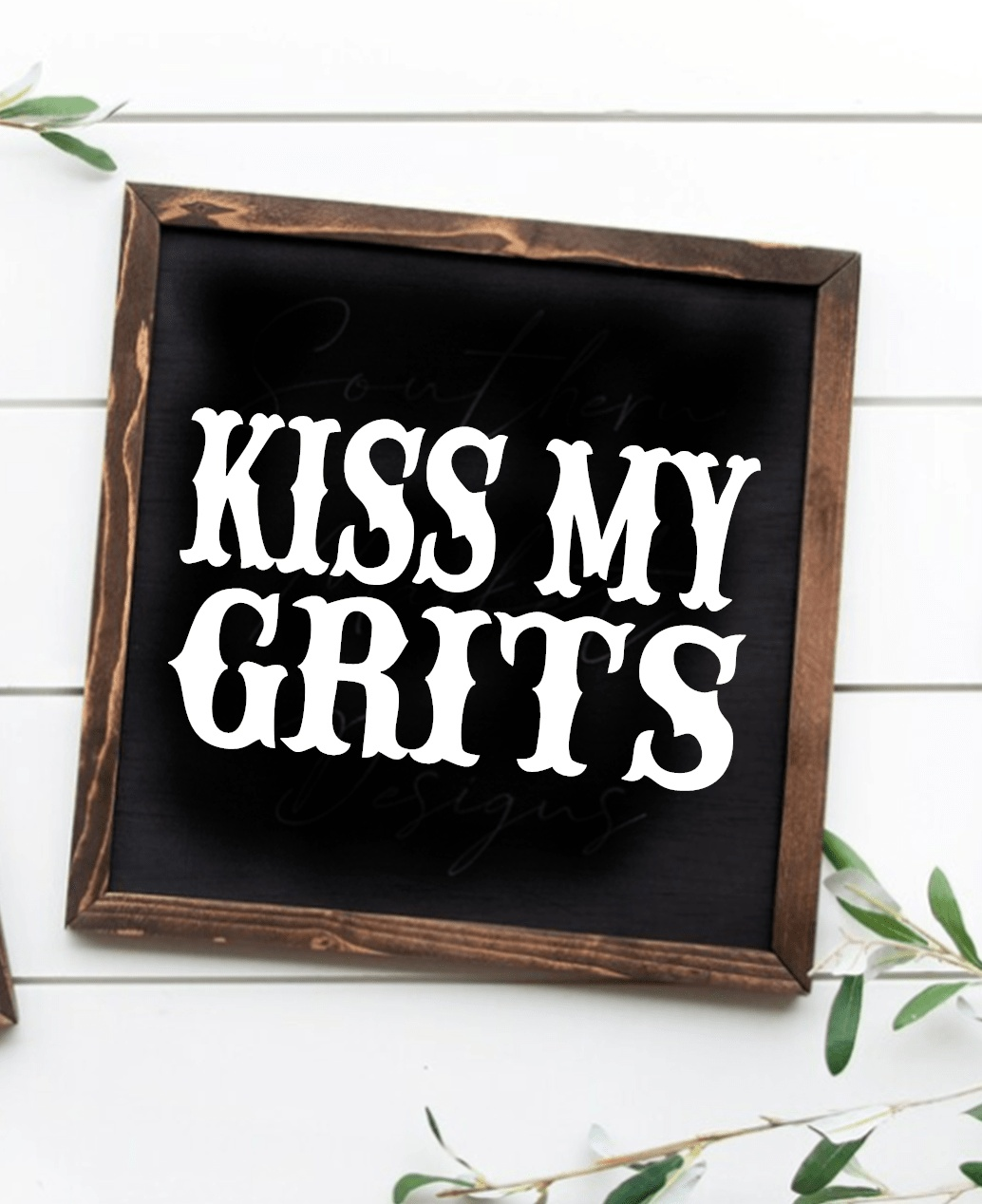 Handcrafted "Kiss My Grits" framed wood sign with black background and white lettering.
