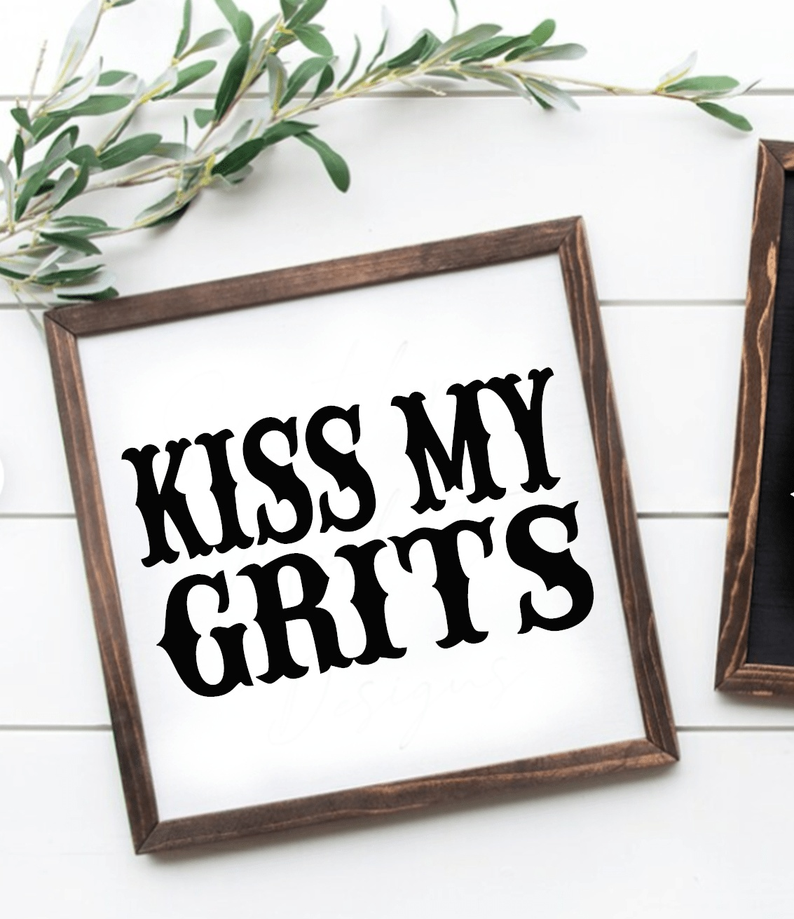 Handcrafted "Kiss My Grits" framed wood sign with white background and black lettering.