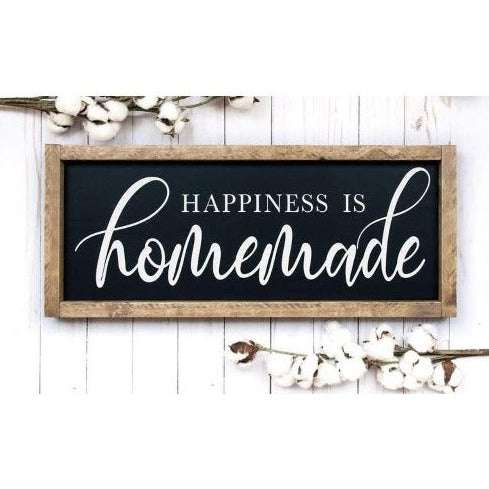 Handmade wood sign with "Happiness is Homemade" in white lettering, black background, framed with stained wood, perfect for kitchen or family room décor.