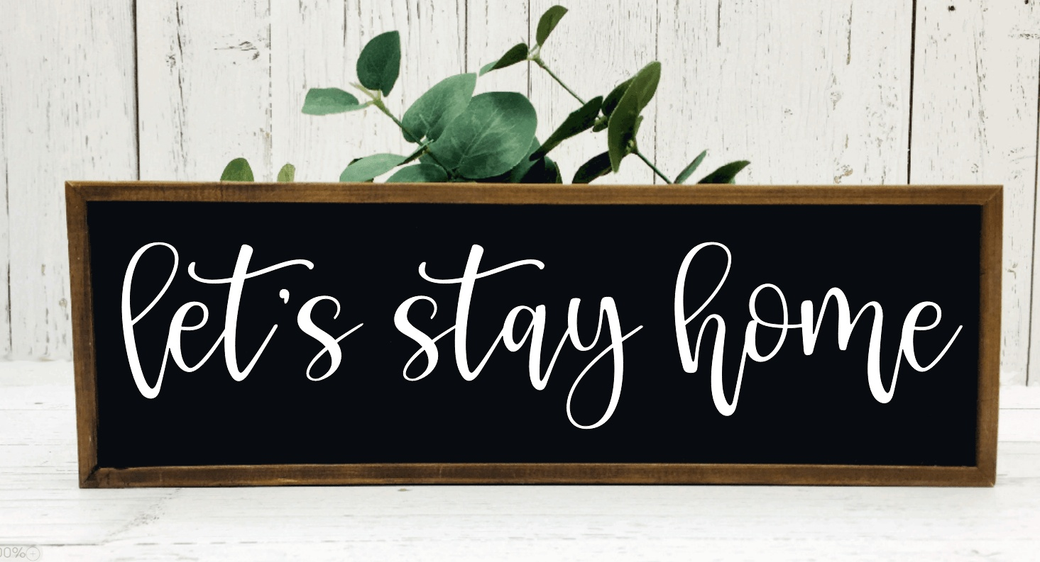 Handmade "Let's Stay Home" rustic wood sign, black background with white lettering, 9x30 inches, stained frame.