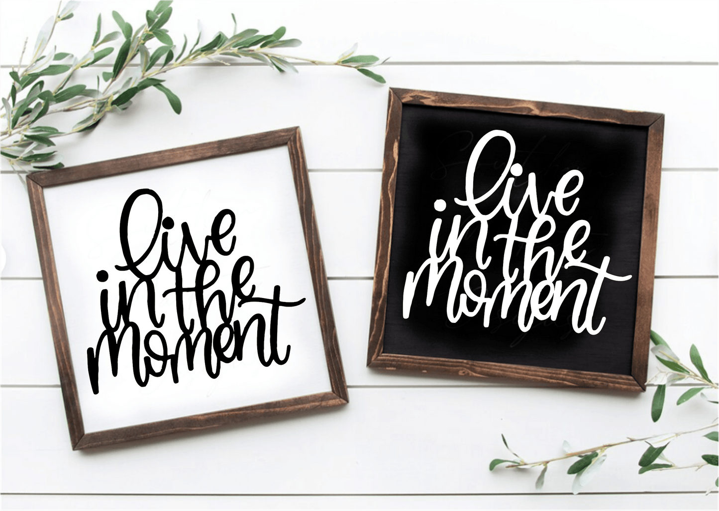Handcrafted framed wood sign with "Live in the Moment" text in black on white and white on black backgrounds.