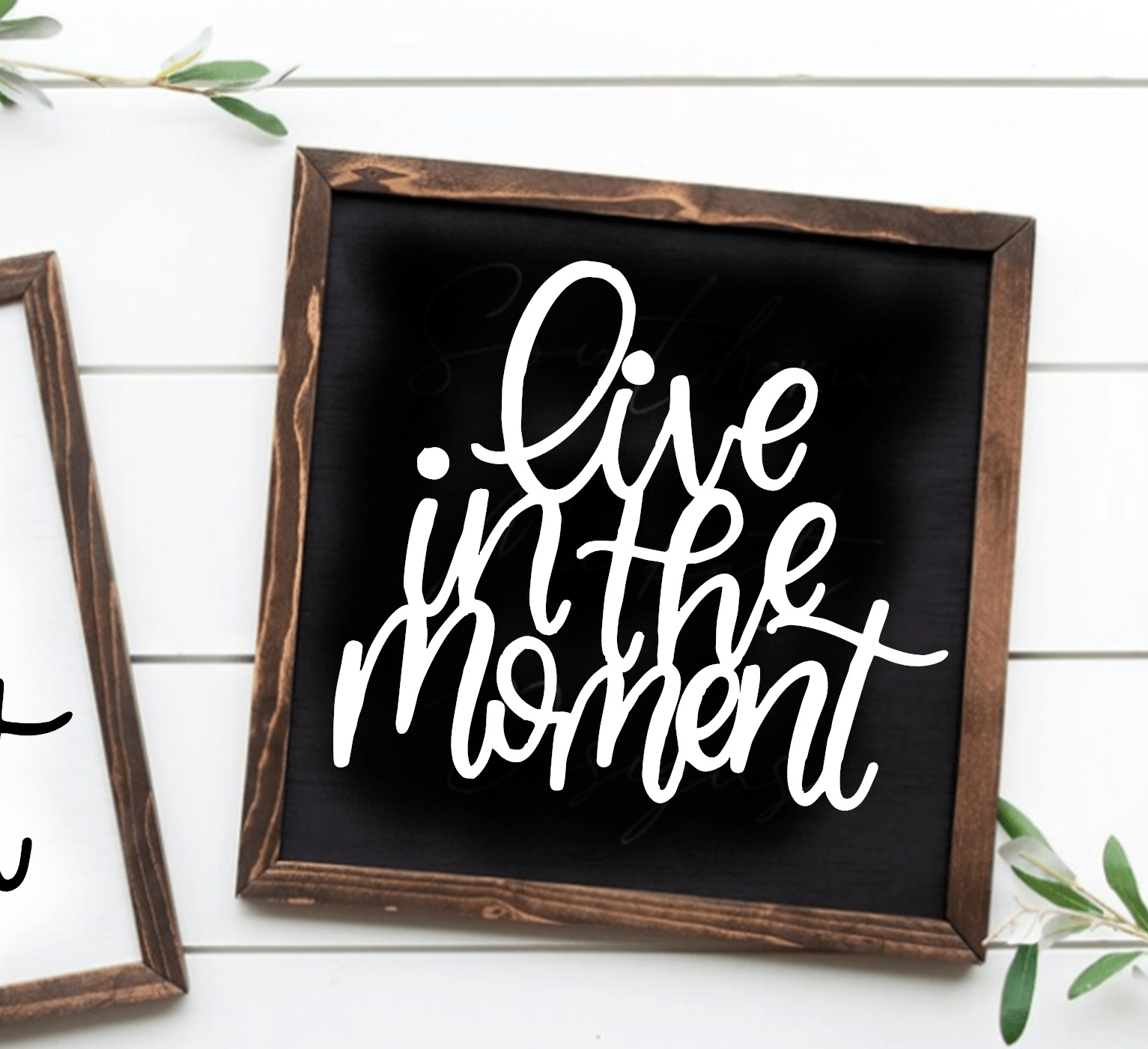 Handcrafted "Live in the Moment" framed wood sign with black background and white lettering.