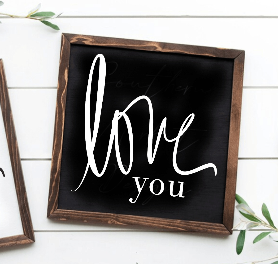Handcrafted wood sign with "Love You" text, black background, and stained frame. Suitable for home decor.
