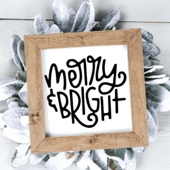 Handmade "Merry & Bright" wood sign with black lettering on white background, framed with rustic wood.