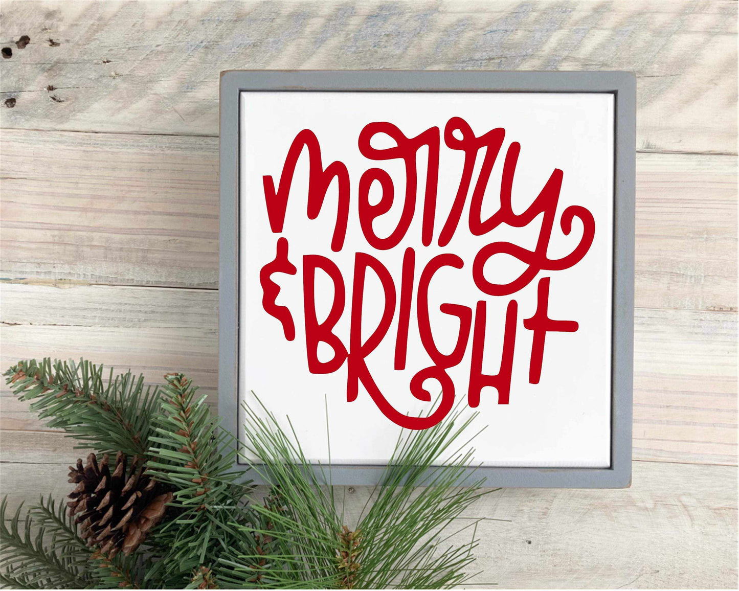Handmade "Merry & Bright" framed wood sign with festive red lettering on a white background, rustic holiday decor.