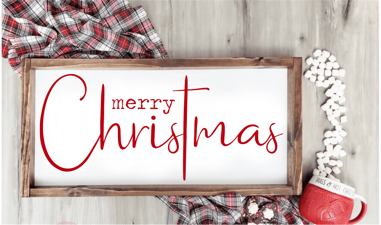 Handmade cross wood sign with "Merry Christmas" script in red on white background, surrounded by cozy holiday decor.