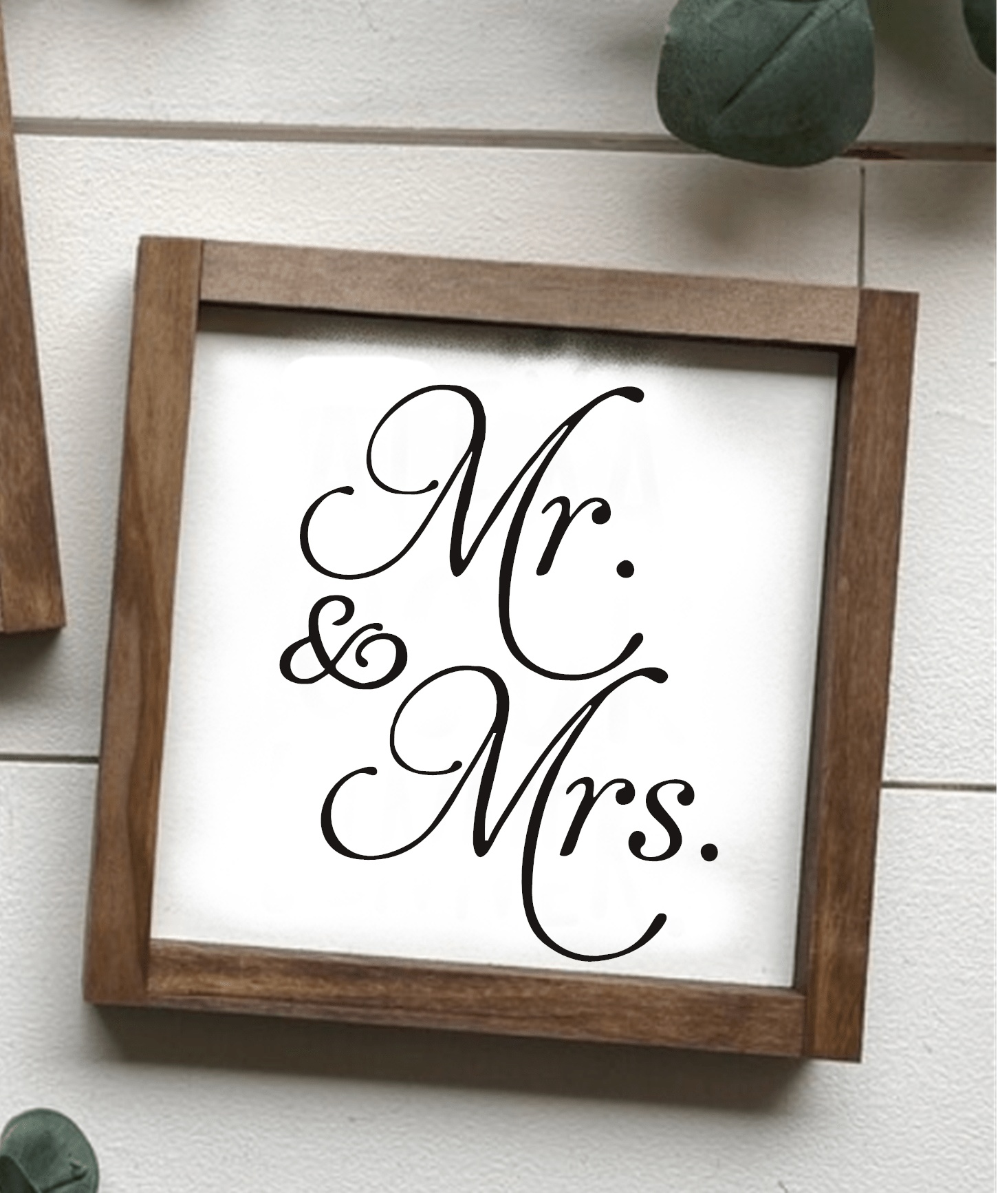 Handcrafted "Mr and Mrs" wood sign with stained frame and black lettering on a white background.