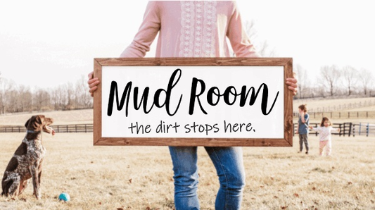 Rustic handcrafted wood sign with "Mud Room - the dirt stops here" text.