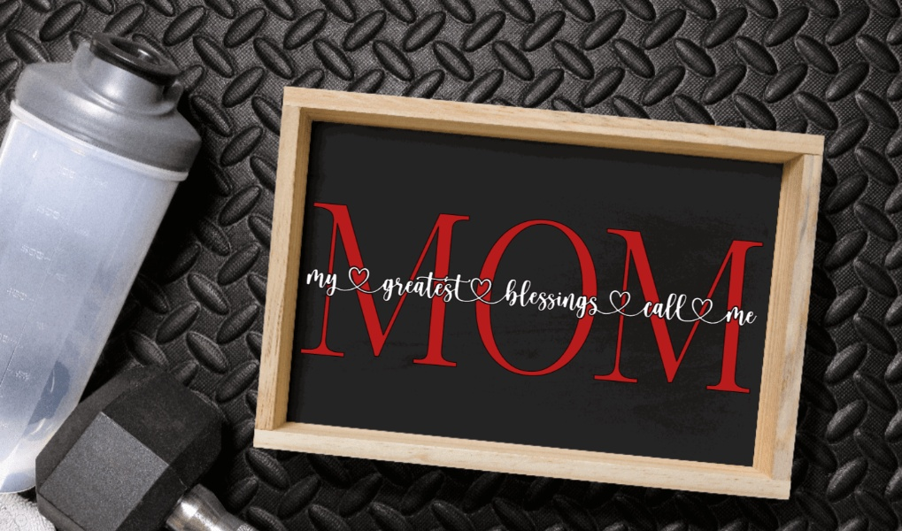 Personalized wood sign with "My Greatest Blessings Call Me Mom" message, customizable with children's names, black chalk paint background, natural wood frame.